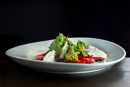 Delicious salad with red pepper and cheese.の写真素材