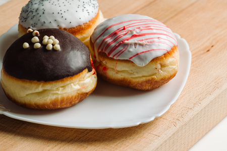 German donuts - Three donuts with different icing.の写真素材