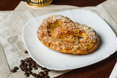 Turkish sweets - sweet bagel with filling sprinkled with pieces of nuts.の写真素材