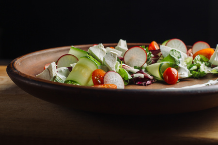 Salad with arugula, cucumber, cottage cheese and radish.の写真素材