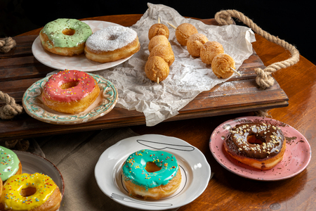 Cottage cheese balls and donutts on wooden skewers, lie on craft paper-2.の写真素材
