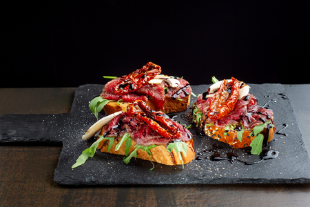 Marbled beef bacon sandwiches with mushrooms and sun-dried tomatoes.の写真素材