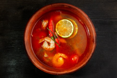 Shrimp soup or Tom Yam goongTraditional food in Thailand contains chili, lime, ginger, galangal, lemongrass, lime leaf.の写真素材