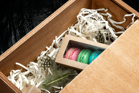 Multi-colored almond macaroni biscuits in a big gift box.の写真素材