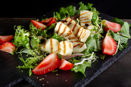 Salad with grilled halumi with strawberries and arugula-2.の写真素材
