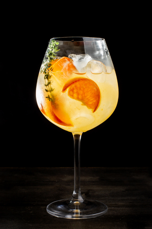 Alcoholic cocktail with orange slices and ice.の写真素材