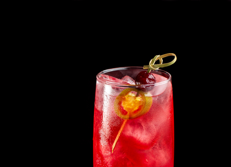 Alcoholic cocktail with cherries. Cherry in transparent glass beaker.の写真素材