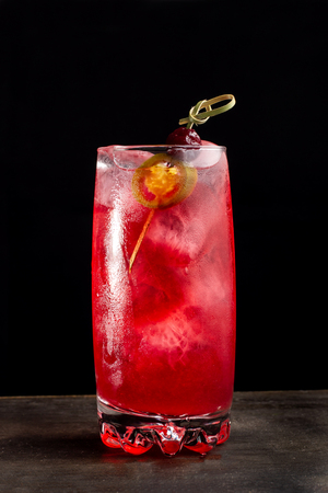 Alcoholic cocktail with cherries. Cherry in transparent glass beaker.の写真素材