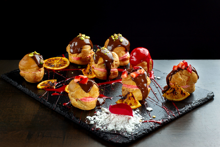 Traditional french eclairs with chocolate and nuts.の写真素材