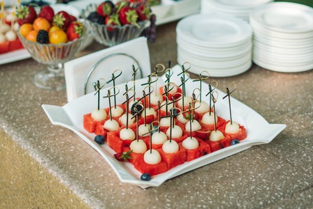 A plate of melon and watermelon dessert on a beautiful white plate.の写真素材