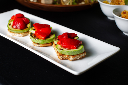 Bread with zucchini zucchini and red sweet pepper grilled.の写真素材