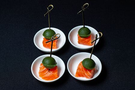 Smoked salmon canape with mousse, bonded with bamboo sticks.の写真素材
