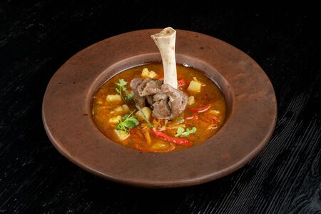 Soup with pepper, potatoes and bone with meat-2.の写真素材
