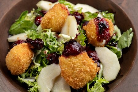 Tasty Homemade Cheese Donuts Jam, poured with pear and salad.の写真素材
