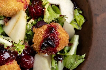 Tasty Homemade Cheese Donuts Jam, poured with pear and salad.の写真素材