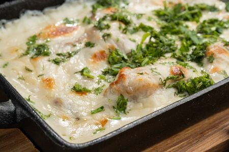 Cheese casserole with chicken and herbs. Beautiful baked crust.の写真素材