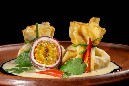 Pancakes stuffed with soyce and hot pepper. With delicious granadilla.