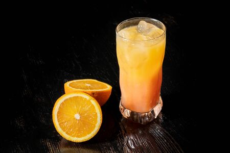 Paradise is a cocktail that contains gin, apricot brandy and orange juice.の写真素材