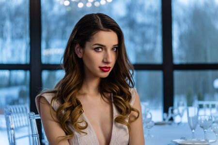 Beautiful girl bride in front of the camera, designer dress, sensual look.の写真素材