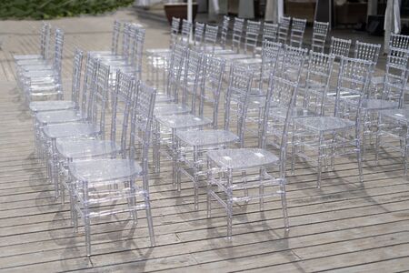 Chiavari chairs are transparent, at a beautiful wedding event.の写真素材