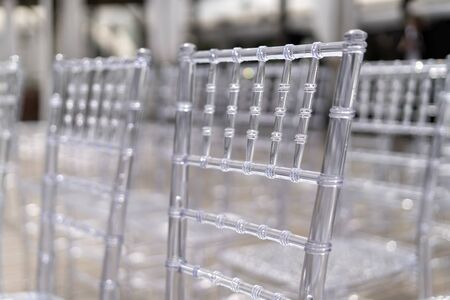 Chiavari chairs are transparent, at a beautiful wedding event.