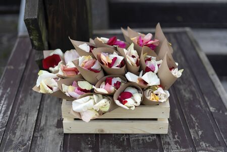 Wooden box with pouches filled with petals. For showering at a wedding.の写真素材