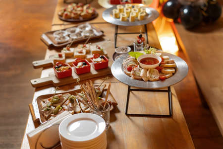 Assorted meat, stuffed chicken roll, a beautiful table with snacks.の写真素材