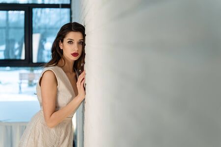 Beautiful girl bride in front of the camera, designer dress, sensual look-2.の写真素材