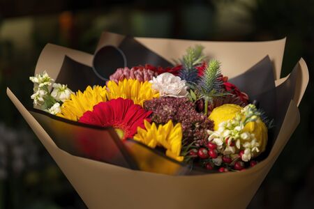 Bouquet of gerberas, carnations and other pink flowers. On a black isolated background. Clouse-up.の写真素材