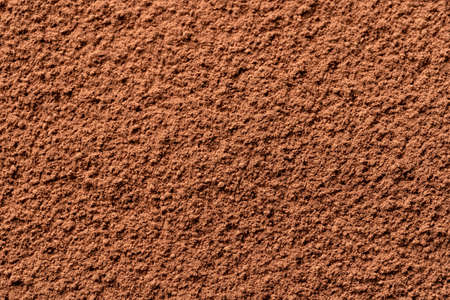 Cocoa powder background, top view. Good contrast light.の写真素材