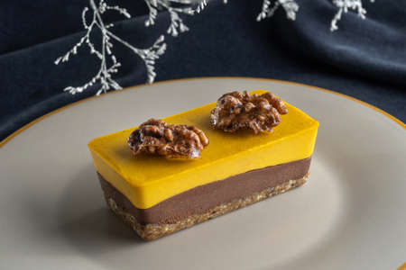 Homemade pumpkin pie with chocolate, and nuts. Decorated with walnuts.の写真素材