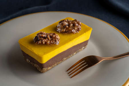 Homemade pumpkin pie with chocolate, and nuts. Decorated with walnuts.の写真素材
