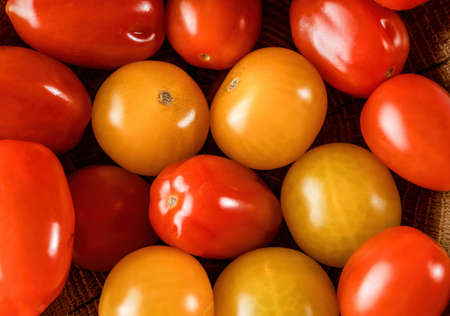 Delicious red and yellow tomatoes. Summer tray market agriculture farm full of organic vegetables.の写真素材