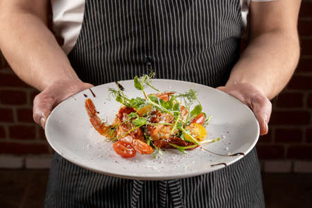 Prawn salad. Healthy Shrimp Salad with mixed greens and tomatoes, the food glows in a beautiful backlight.の写真素材
