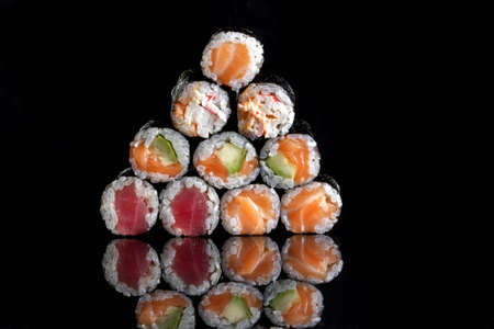Rolls with salmon, rice, nori, fresh salmon. A pyramid of rolls.の写真素材