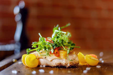 Roasted Duck Meat with Tomatoes, Small Green Sprouts and Sauce.