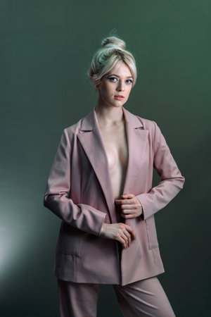 Sexy young blonde, a jacket dressed on a naked body-2.の写真素材
