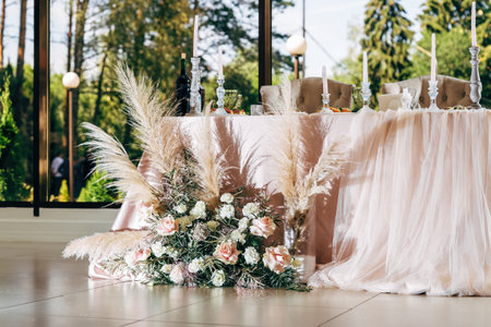 Nicely decorated table for newlyweds. Wedding table with rustic elements, natural decor.の写真素材