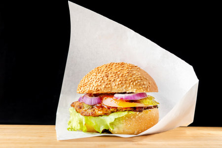 Burger with red onion, meat, tomato, ketchup. Sesame buns, large lettuce-2.の写真素材