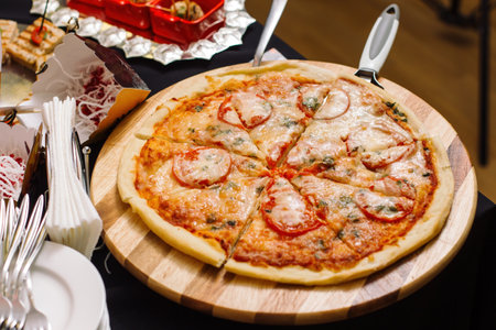 Italian pizza with tomato topped with melted cheese, herbs and basil-2.の写真素材