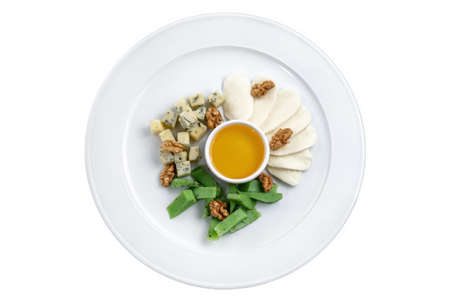 Cheese platter with different varieties. Mozzarella, pesto cheese, gorgonzola cheese, honey, walnut.の写真素材