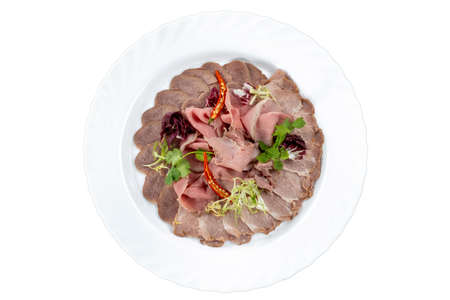 Meat platter, beef tongue, meat garnished with herbs and paprika.の写真素材