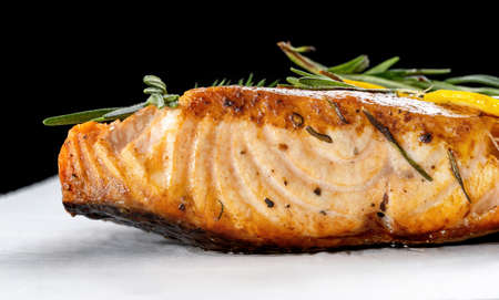 Salmon with lemon steak, decorated with rosemary.の写真素材