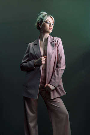 Sexy young blonde, a jacket dressed. A detached look a little to the side.の写真素材
