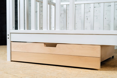 The image of the childs bed, bottom view of the storage drawers. An unpainted drawer-2.の写真素材
