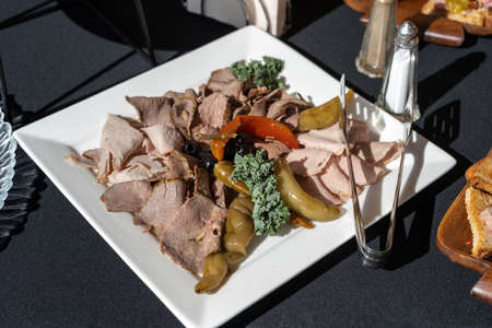Assorted fresh cold cut platter Italian appetizer.