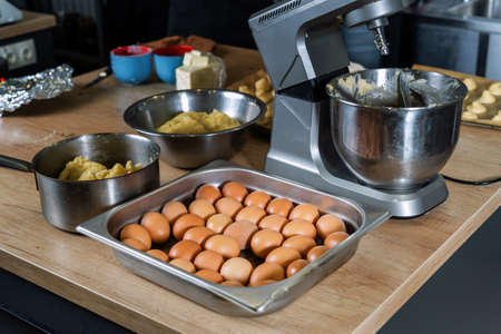 Preparation of dough, restaurant kitchen, true cuisine, not very clean dishes.