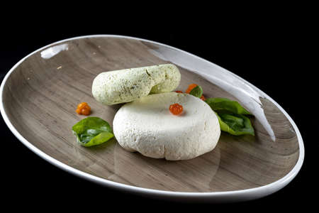 Fresh homemade spread cream cheese with herbs, garlic, chives and spices. Side viewの写真素材