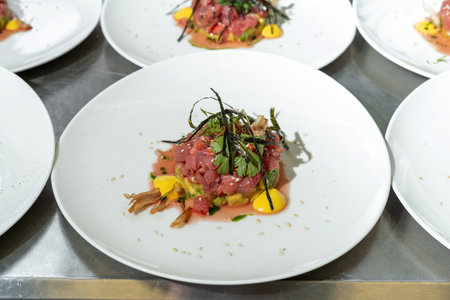 Tartarus from young calf with avocado, garnished with nori leaves and parsley.の写真素材