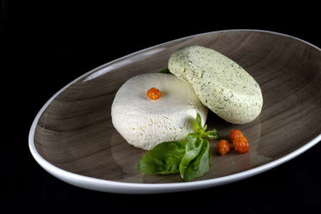 Fresh homemade spread cream cheese with herbs, garlic, chives and spices. Diagonal viewの写真素材